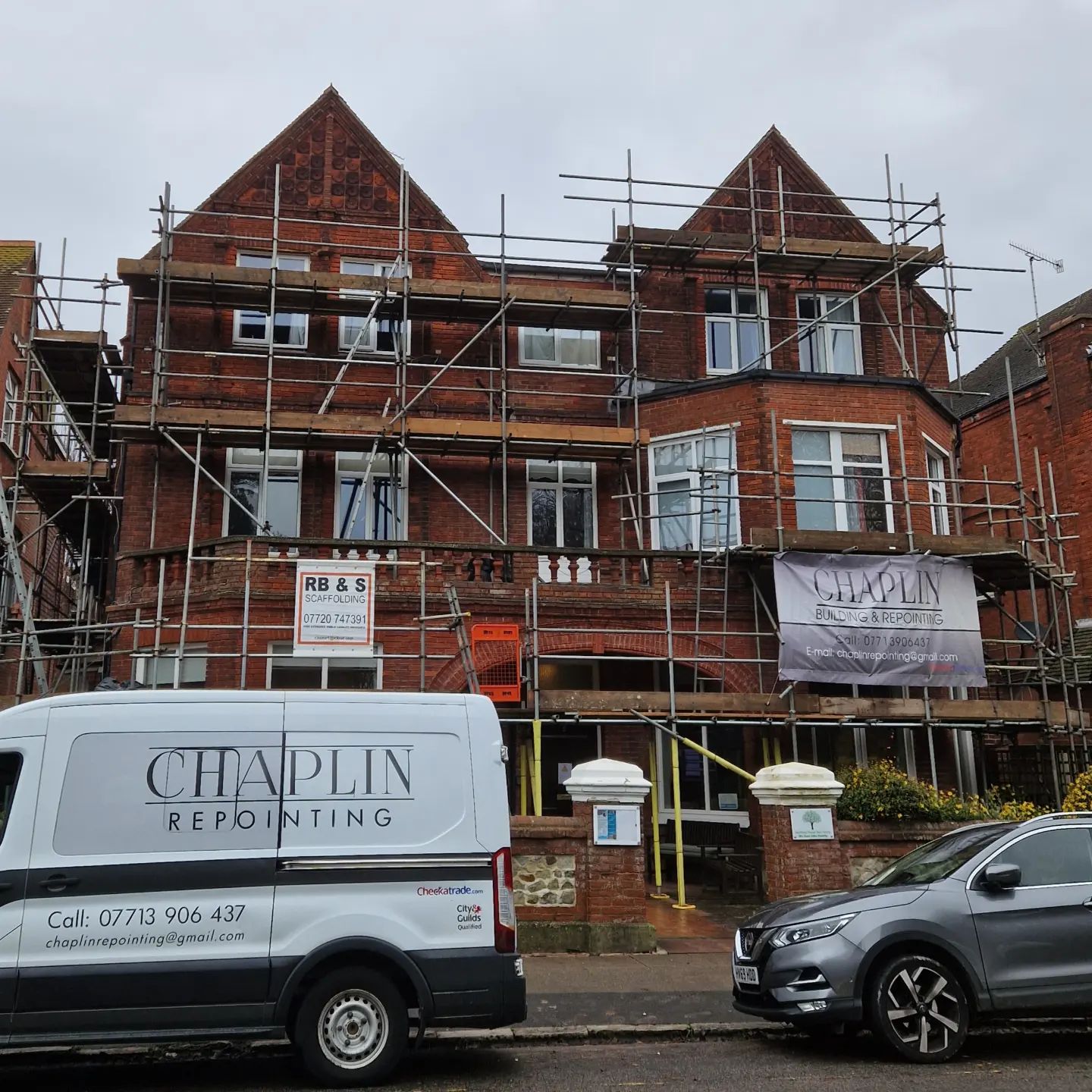 Three-storey Victorian block on scaffold with the Chaplin van parked in front